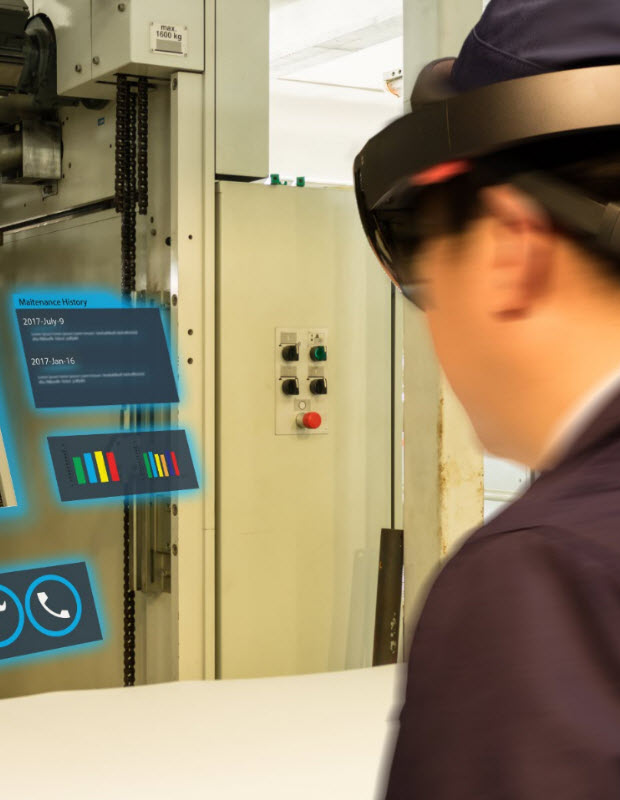Man using augmented reality to learn how to operate machinery at work