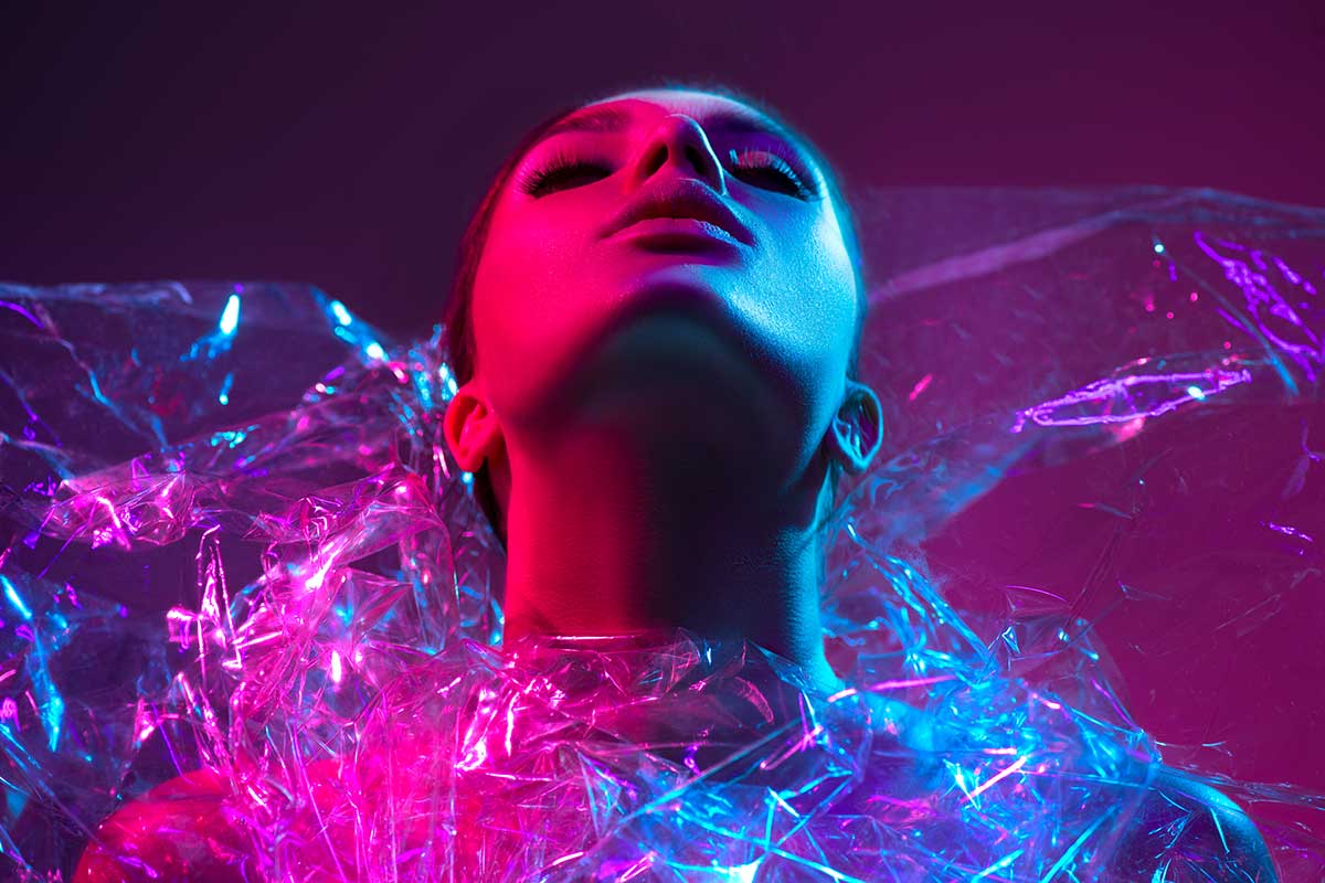Fashion model in modern clothes and neon lights