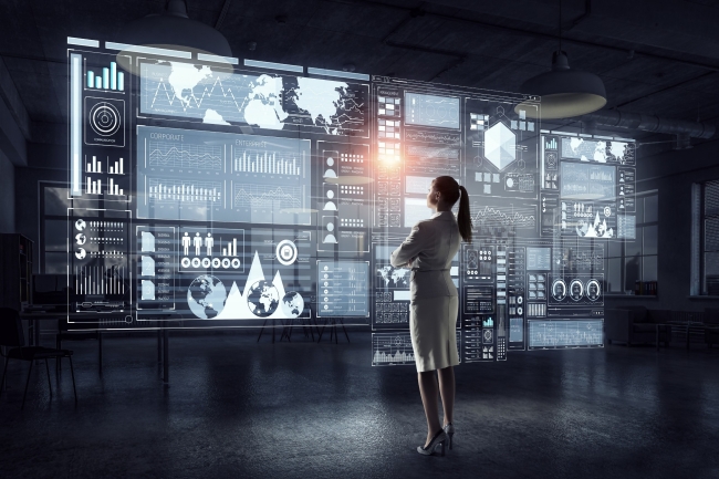 Woman looking virtual monitors showing customer data privacy implementation