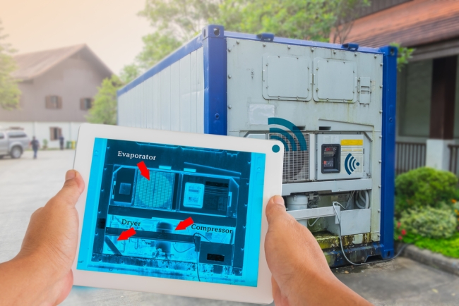 Hand holding tablet with AR maintenance application