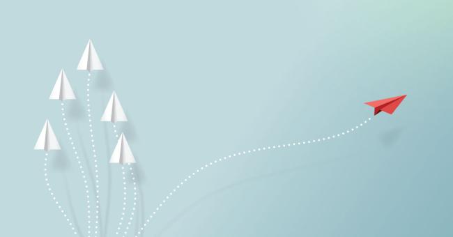 Top 3 Business Challenges and How Outsourcing Can Help Image of paper airplane taking off in its own direction