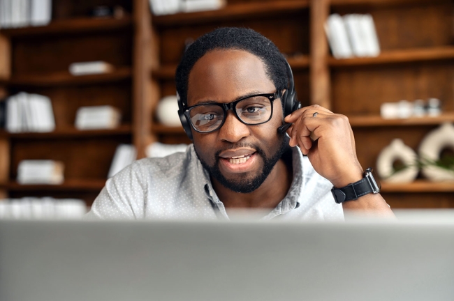 Balancing Empathy, Technology and Cost in Contact Centers Customer support agent headset showing empathy