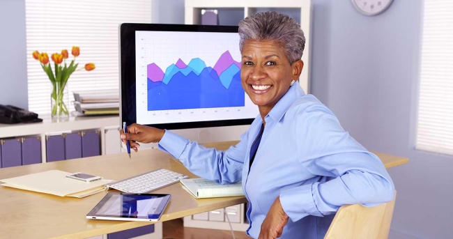 Executive quotes around digital transformation Executive at desk with tablet and computer