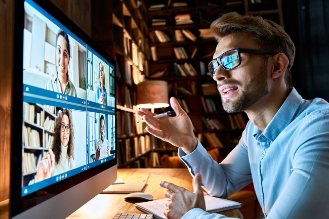 eLearning is one important learning modality Employee on video call with coworkers