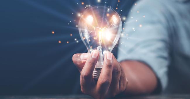 11 business leaders to meet with when forming learning strategy Holding lighted bulb innovation strategy