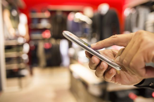 Someone looking up product information on their phone