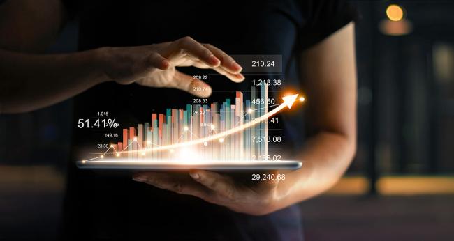 3 Channels to Enable Future Partnerships Businessperson with tablet and sales data