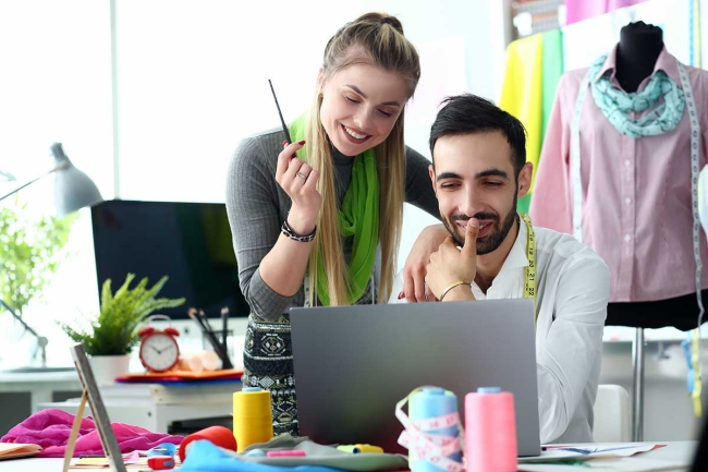 Futureproof your fashion business Two fashion designers work on computer