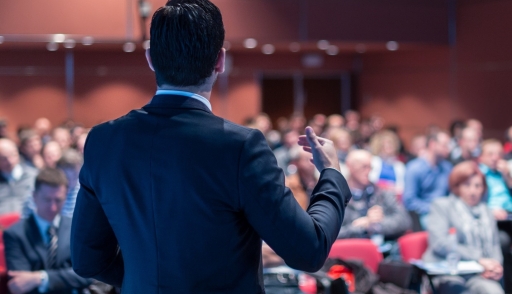 Influencer giving a speech at a corporate learning event