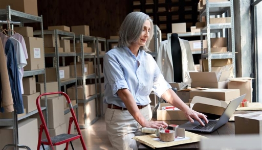 woman in front of clothing materials