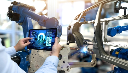 Engineer hand using tablet with machine real time monitoring system software 