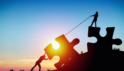 Partners put puzzle together business concept