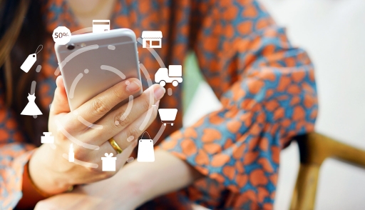 Female shopper on smartphone with shipping, logistics icons