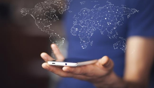 Man holding smartphone with world map