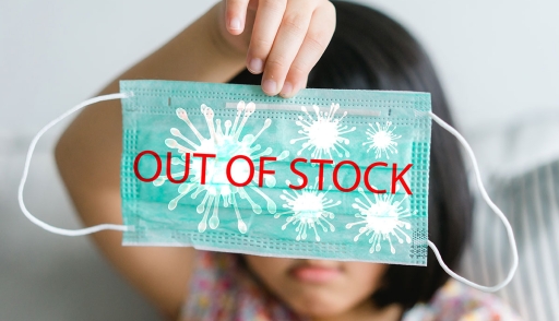 Child holding out of stock mask