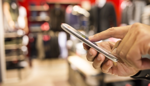 Someone looking up product information on their phone