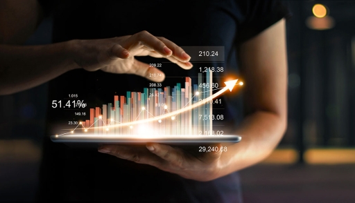 Businessperson with tablet and sales data