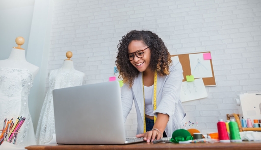 A fashion designer working on computer PLM