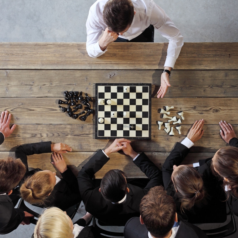 Winning Mindshare Channel Marketing One person plays against a team at chess